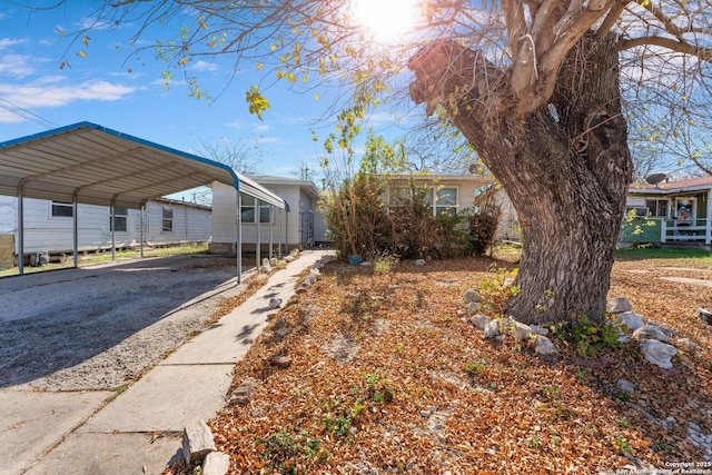 exterior space with a carport