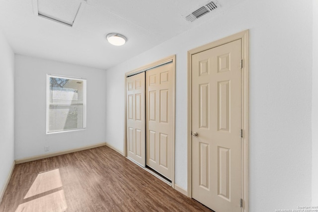 unfurnished bedroom featuring wood-type flooring