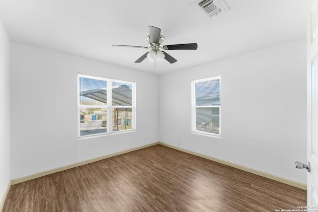 spare room with ceiling fan and wood-type flooring