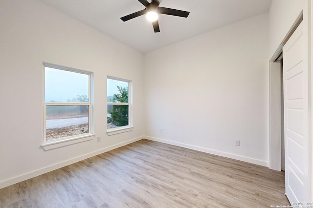 unfurnished bedroom with ceiling fan and light hardwood / wood-style floors