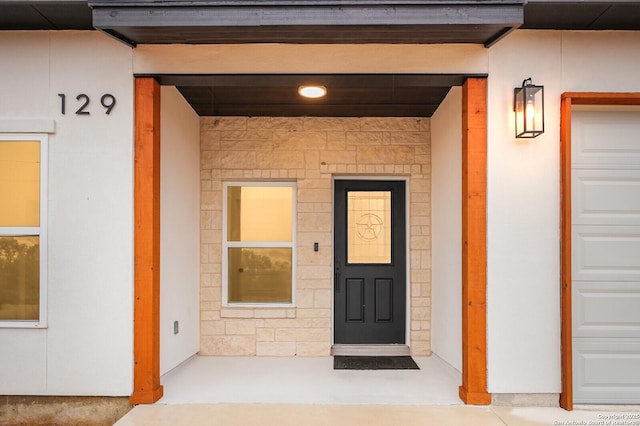 property entrance featuring a garage