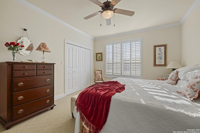 bedroom with light colored carpet, a closet, ornamental molding, and ceiling fan