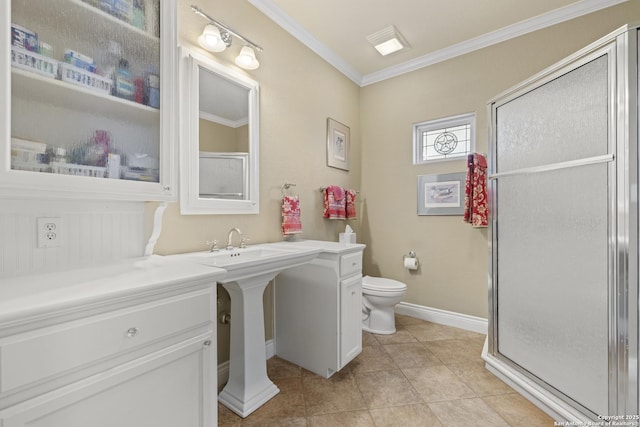 bathroom featuring tile patterned floors, crown molding, toilet, and walk in shower