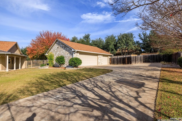 view of home's exterior featuring a lawn, a garage, and an outdoor structure