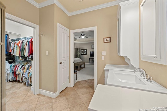 2166 Lightstone, Fredericksburg, TX 78624 - washroom featuring ornamental molding, baseboards, light tile patterned floors, a sink, and a ceiling fan