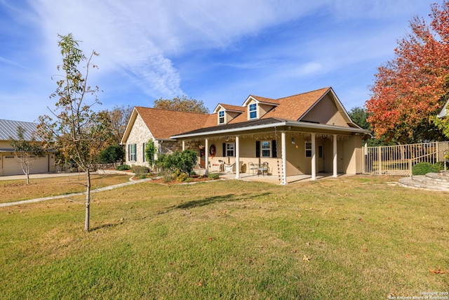 view of front of house with a patio area and a front yard