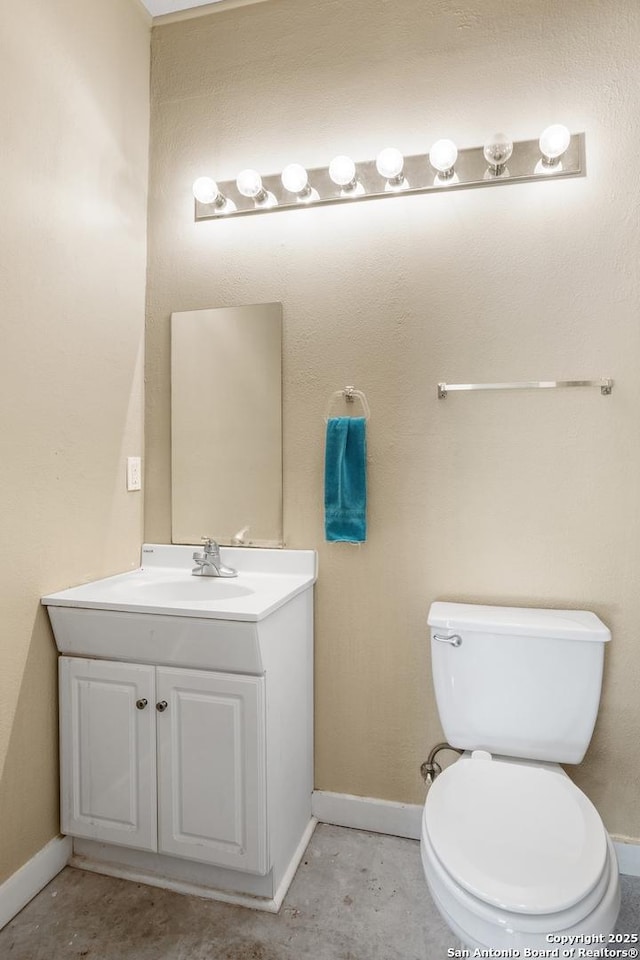 2166 Lightstone, Fredericksburg, TX 78624 - bathroom with vanity, baseboards, and toilet