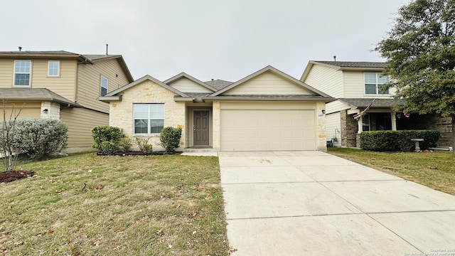 view of front of home with a front yard and a garage