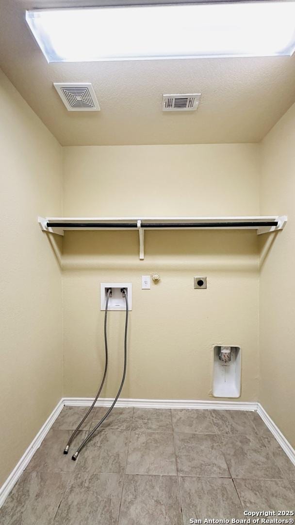 laundry area with hookup for an electric dryer, tile patterned flooring, gas dryer hookup, and hookup for a washing machine