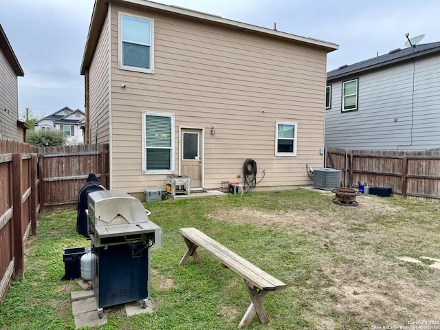 rear view of property with a lawn