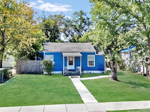 bungalow-style house with a front lawn