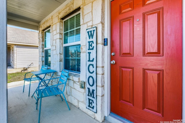 doorway to property with a porch