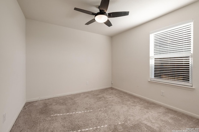 empty room featuring light carpet and ceiling fan