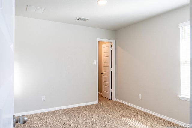 unfurnished room featuring carpet flooring