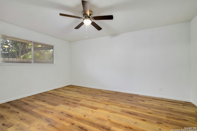 spare room featuring ceiling fan and light hardwood / wood-style floors