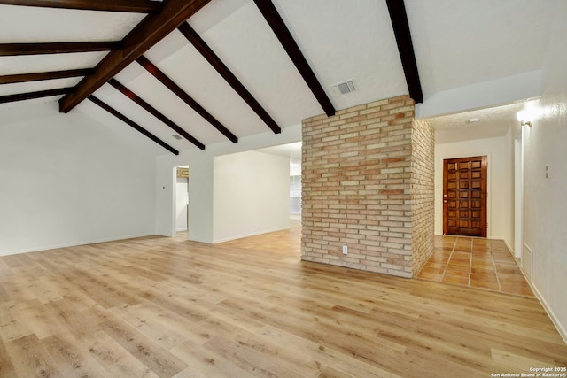 unfurnished living room featuring beamed ceiling, high vaulted ceiling, and light hardwood / wood-style flooring