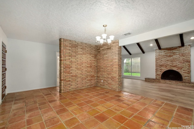 unfurnished living room with tile patterned flooring, a fireplace, beam ceiling, brick wall, and a chandelier