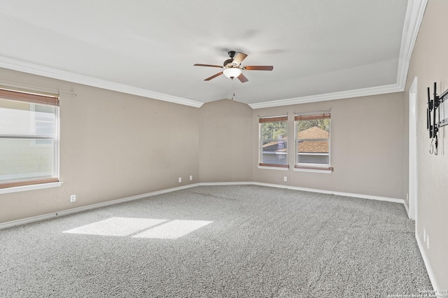 carpeted empty room featuring plenty of natural light, crown molding, and ceiling fan