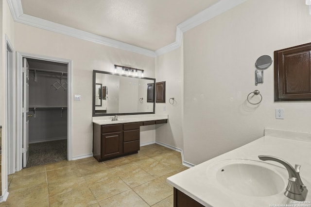 bathroom featuring vanity and crown molding