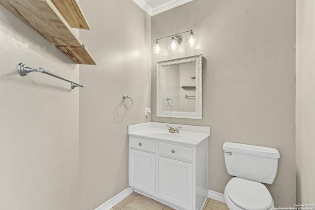 bathroom with tile patterned flooring, vanity, toilet, and crown molding