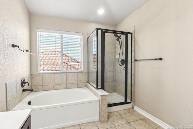 bathroom featuring separate shower and tub and tile patterned flooring