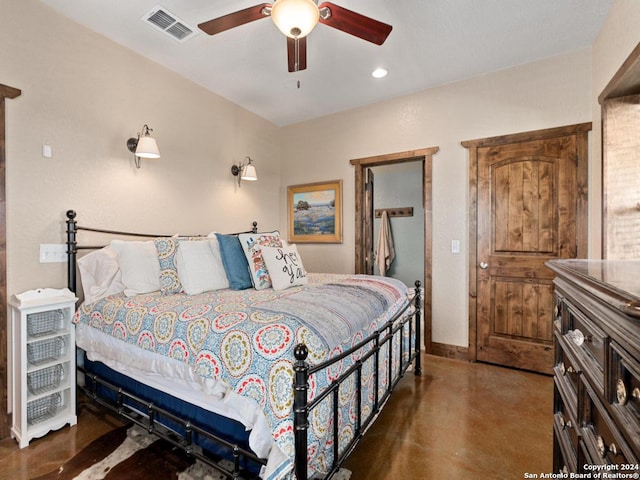 bedroom with ceiling fan and concrete floors