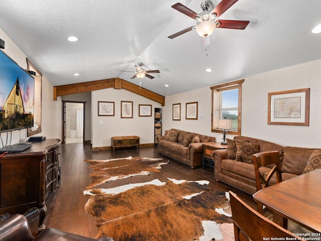 living room with dark hardwood / wood-style flooring, lofted ceiling, and a textured ceiling