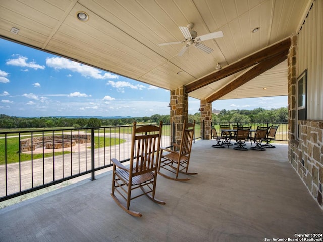 view of patio featuring ceiling fan