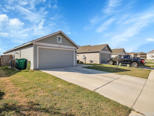 ranch-style house with a garage and a front lawn