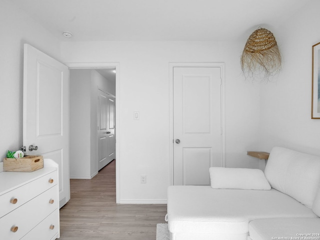 sitting room featuring light hardwood / wood-style flooring