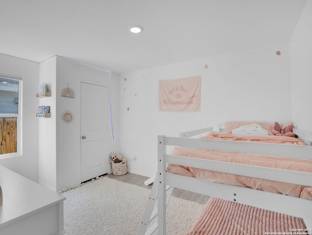 bedroom with light wood-type flooring