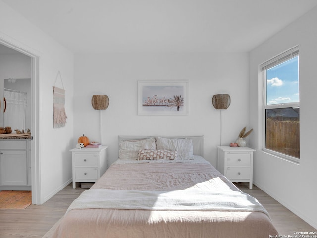 bedroom with light wood-type flooring