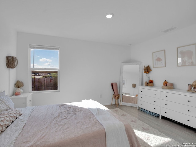 bedroom with light wood-type flooring