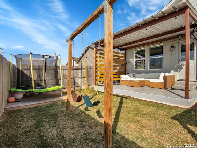 view of jungle gym featuring an outdoor hangout area, a trampoline, a patio area, and a lawn