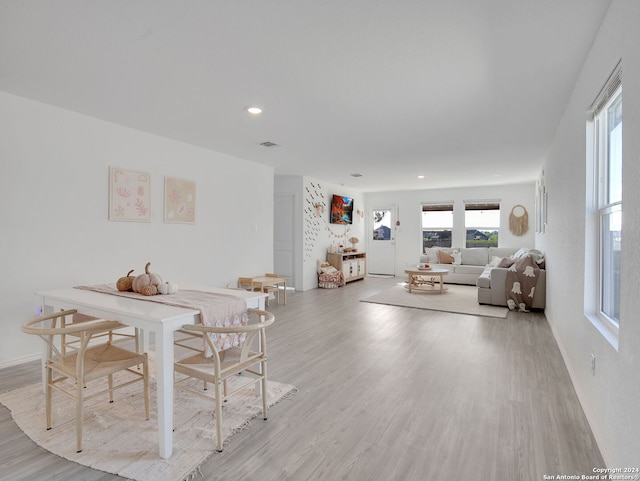 dining area with light hardwood / wood-style floors