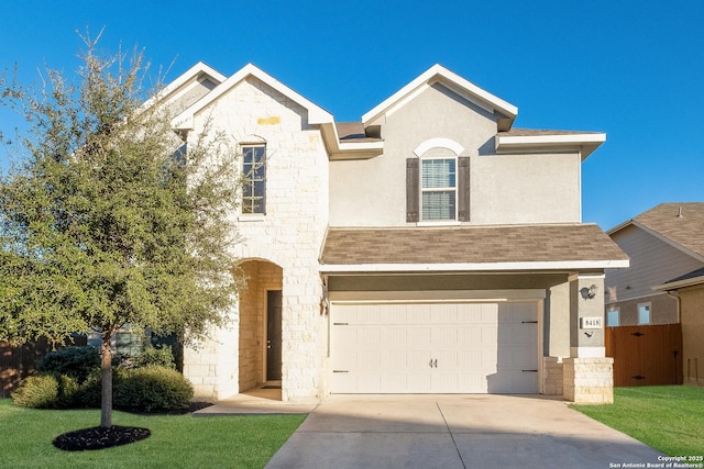 view of front of house featuring a front lawn and a garage