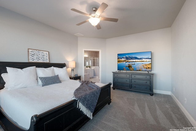 carpeted bedroom featuring connected bathroom and ceiling fan