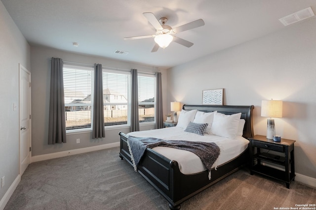 bedroom featuring ceiling fan and dark carpet