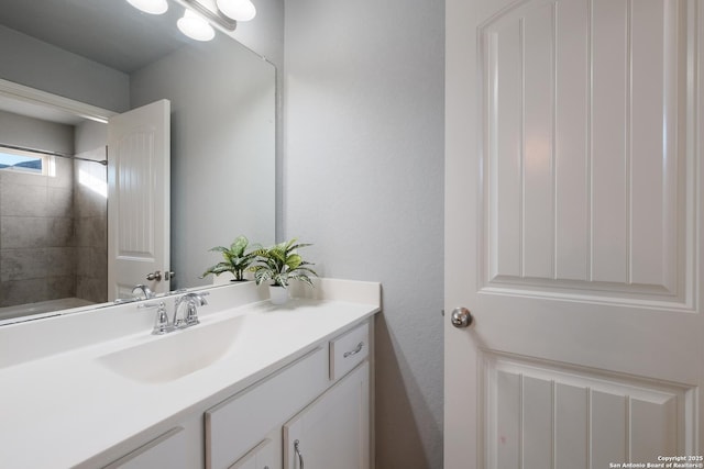 bathroom with vanity and walk in shower