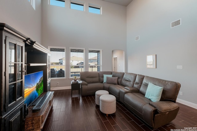 living room with a towering ceiling