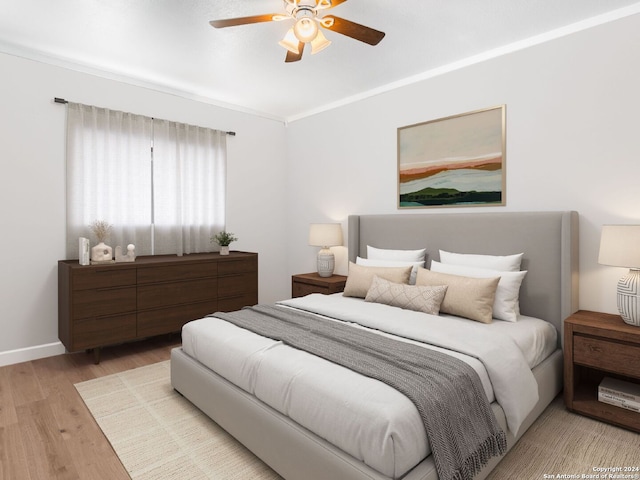 bedroom with ceiling fan, crown molding, and light hardwood / wood-style floors