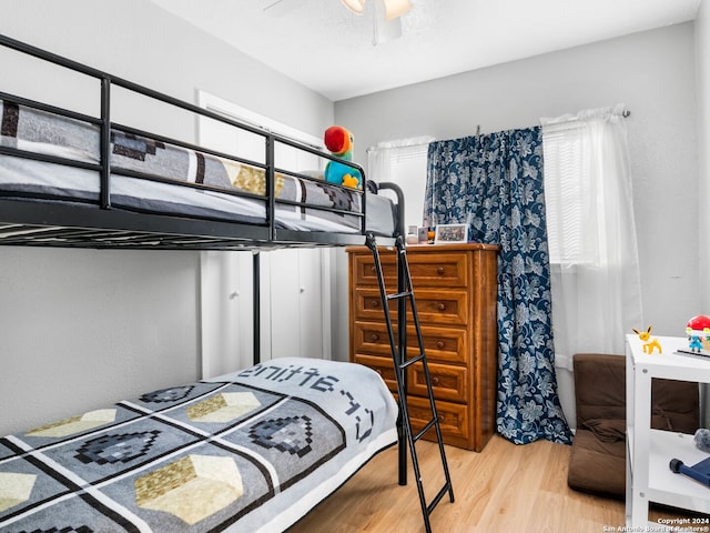 bedroom featuring ceiling fan and hardwood / wood-style floors