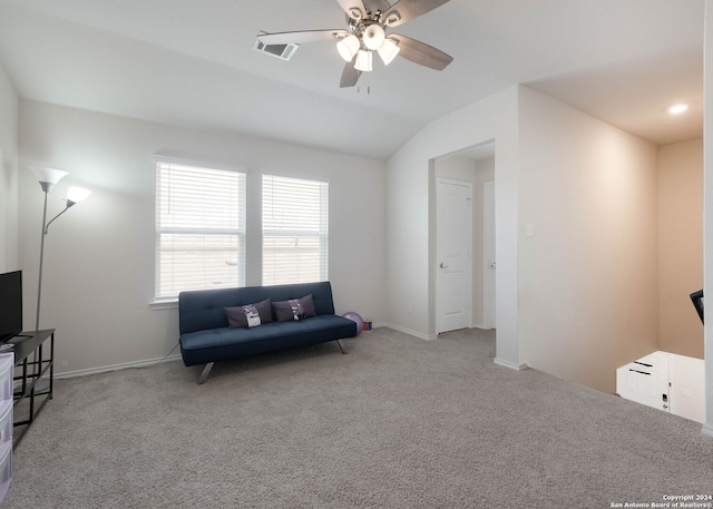 sitting room featuring light carpet, ceiling fan, and vaulted ceiling