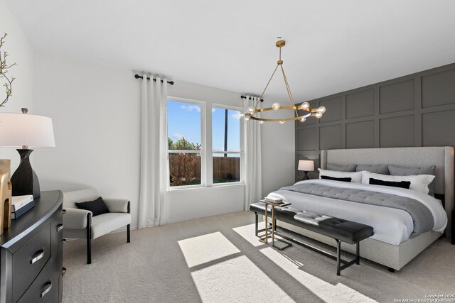 carpeted bedroom featuring a chandelier