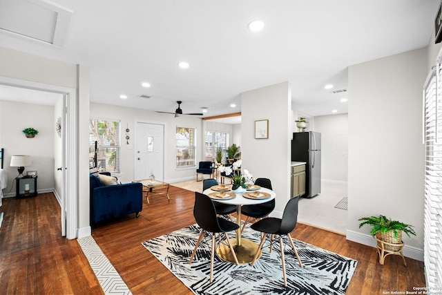 dining area featuring ceiling fan and dark hardwood / wood-style floors