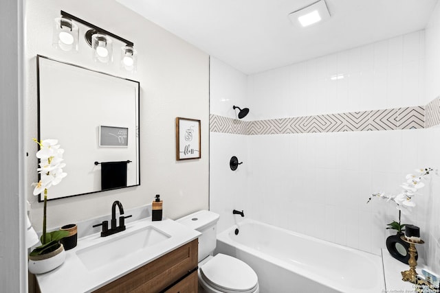 full bathroom featuring vanity, toilet, and tiled shower / bath