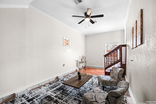 tiled living room with crown molding and ceiling fan