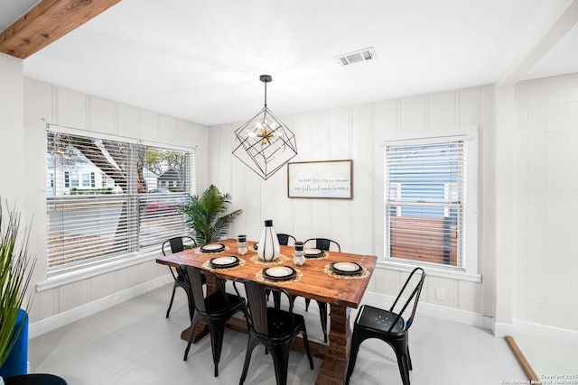 dining area featuring a chandelier