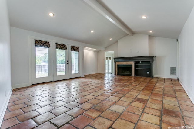 unfurnished living room featuring vaulted ceiling with beams