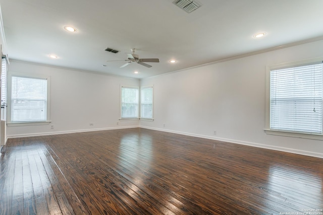 unfurnished room featuring ceiling fan, ornamental molding, and dark wood-type flooring